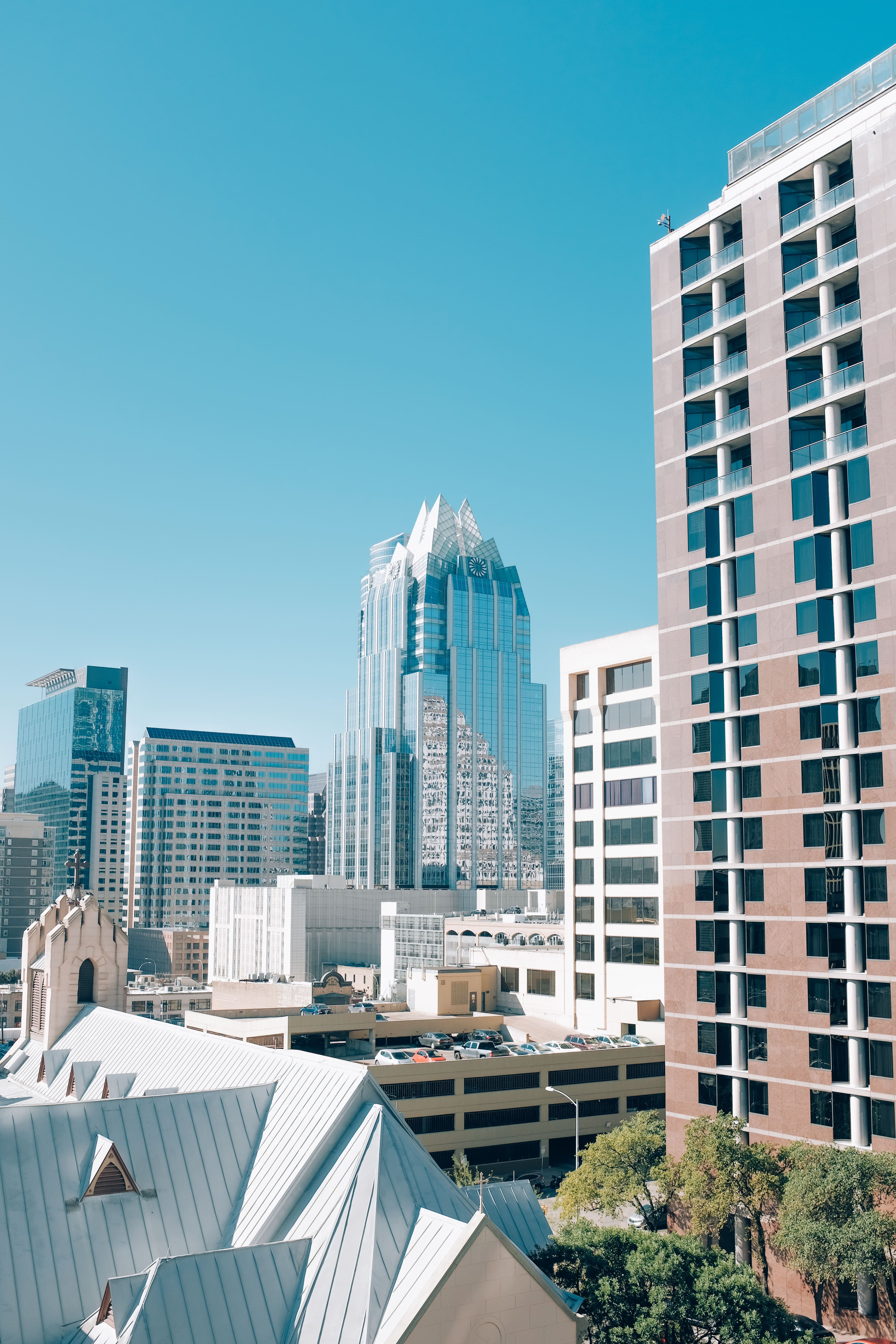 Vertical Shot Buildings Downtown Austin Tall Glass Building Texas Usa Min (1)