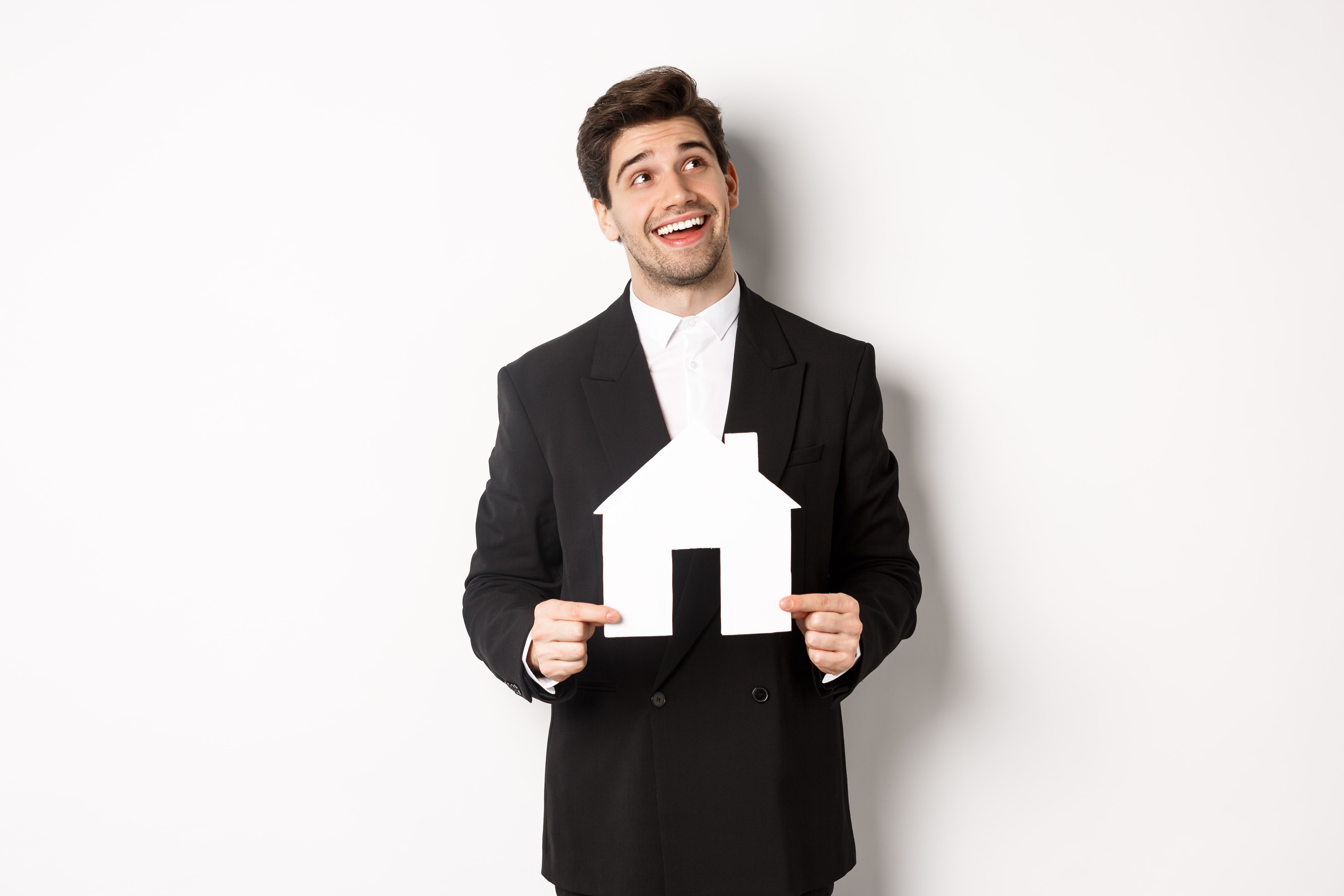 Portrait Handsome Man Suit Searching Home Holding Paper House Looking Upper Right Corner Dreamy Standing White Background Min