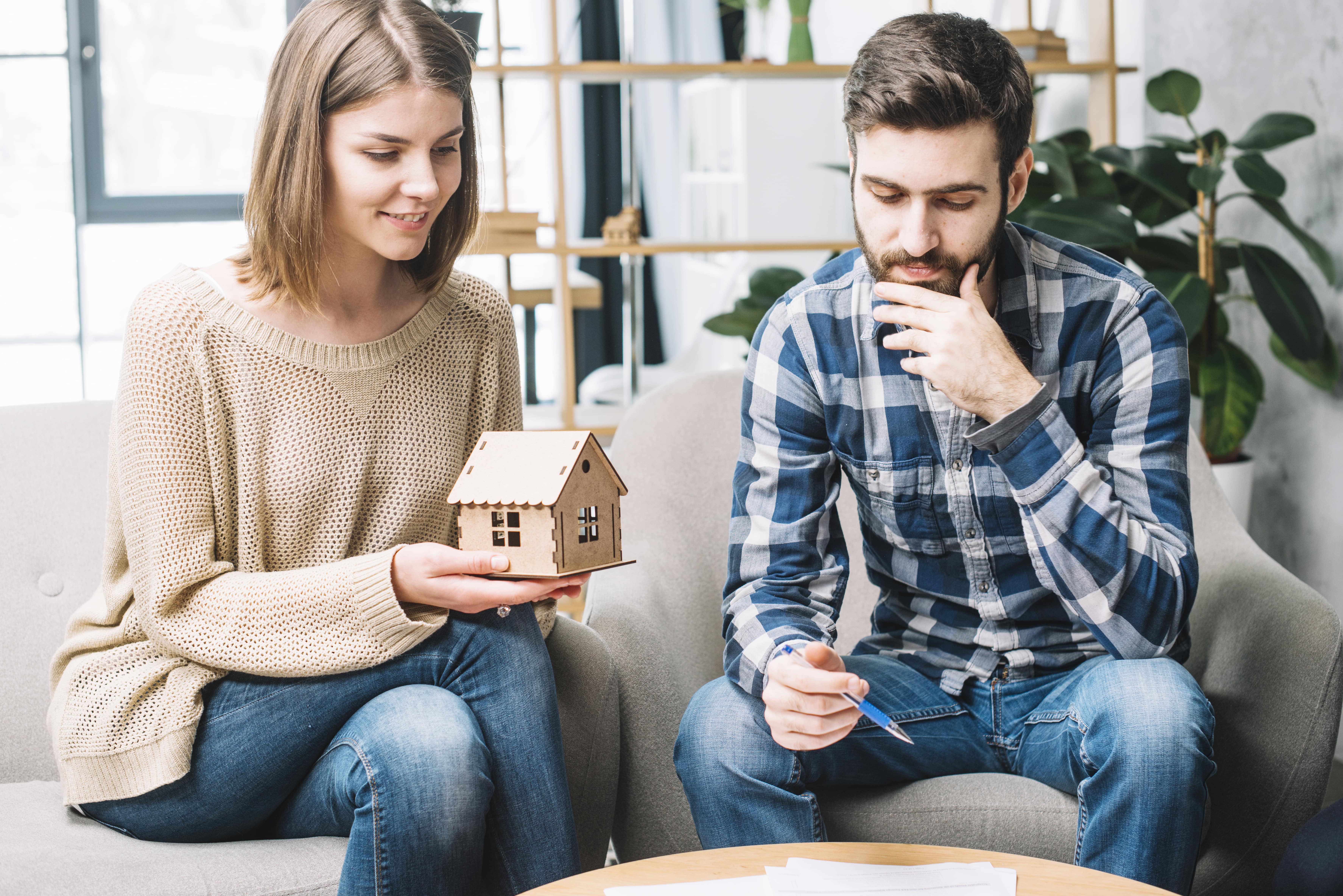 Young Couple Thinking Mortgage Min